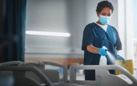 Hospital,Ward:,Professional,Black,Nurse,Wearing,Face,Mask,,Wiping,The