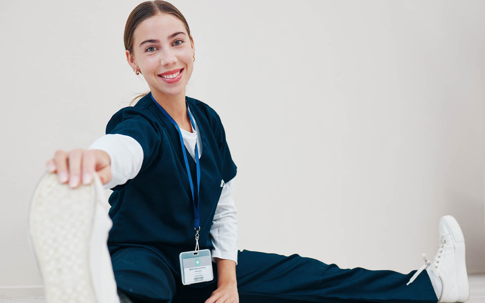 Stretching,,Feet,And,Nurse,With,Legs,On,Floor,In,Exercise