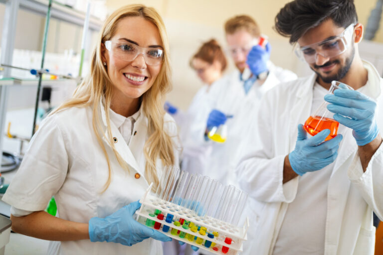Group Of Medical Research Scientists Collectively Working In Laboratory