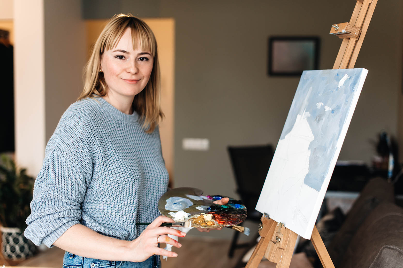 Portrait Of A Happy Artist With A Palette In Hands On The Foreground