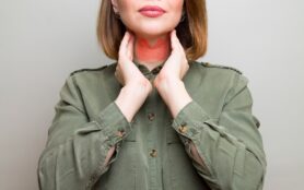 Female,Checking,Thyroid,Gland,By,Herself.,Thyroid,Disorder,Includes,Goiter,