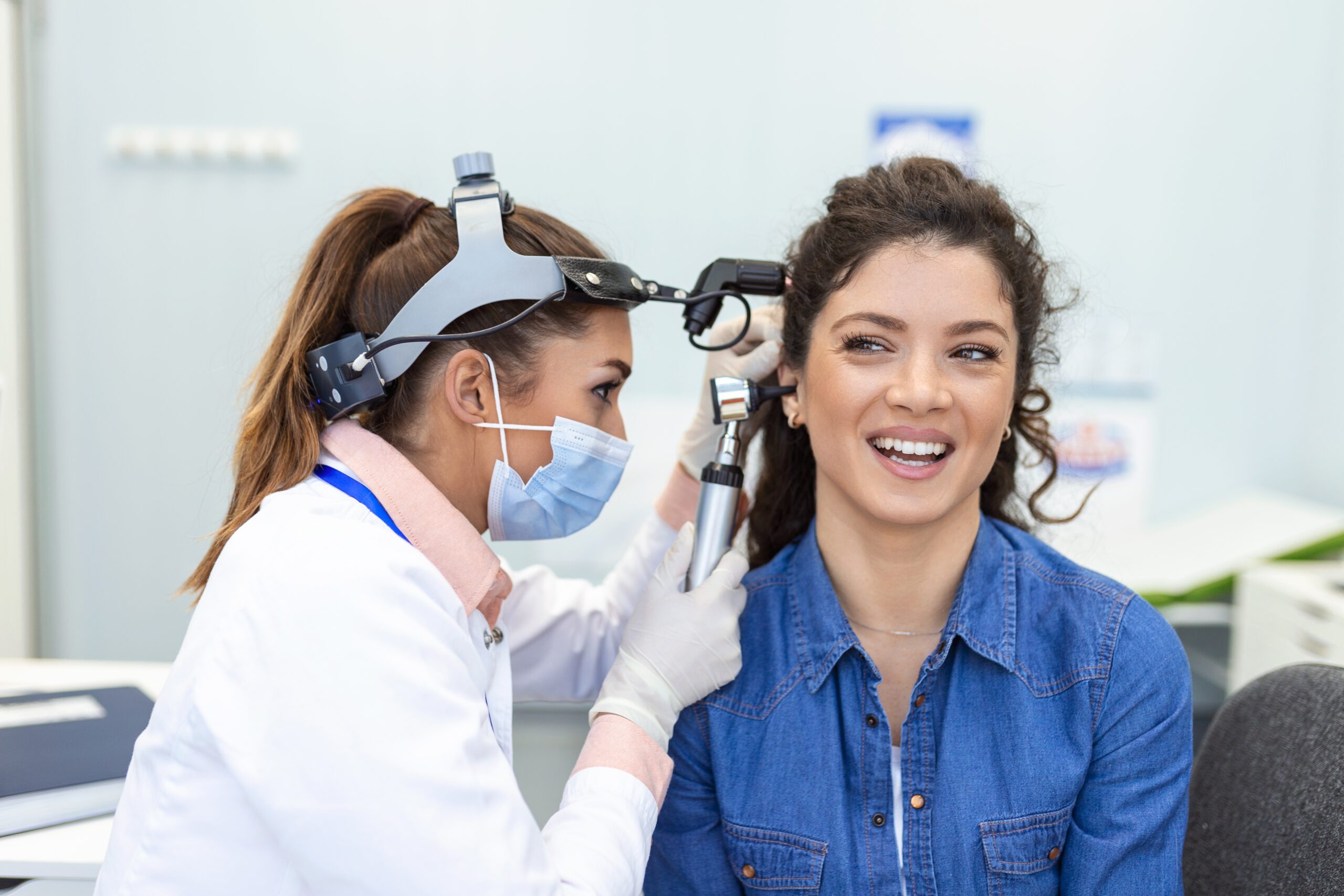 Hearing,Exam.,Otolaryngologist,Doctor,Checking,Woman's,Ear,Using,Otoscope,Or
