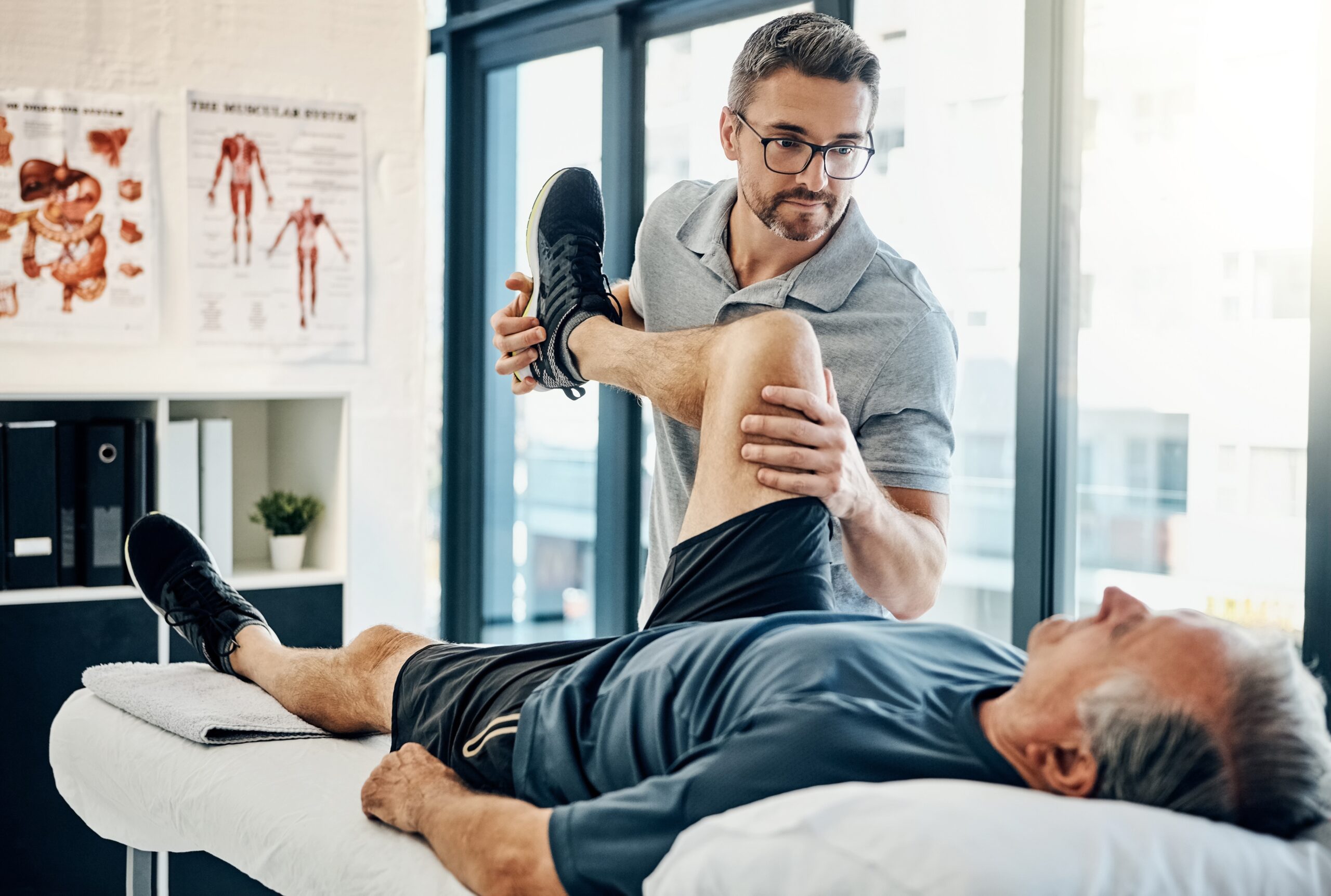 Stretching,Legs,,Rehabilitation,And,A,Physiotherapist,With,A,Man,For