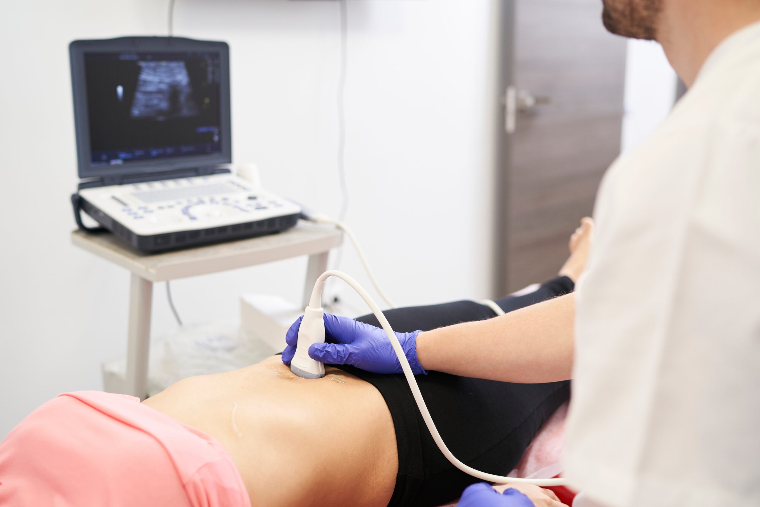 A,Physiotherapist,Performing,An,Ultrasound,Scan,For,Pelvic,Floor,Treatment
