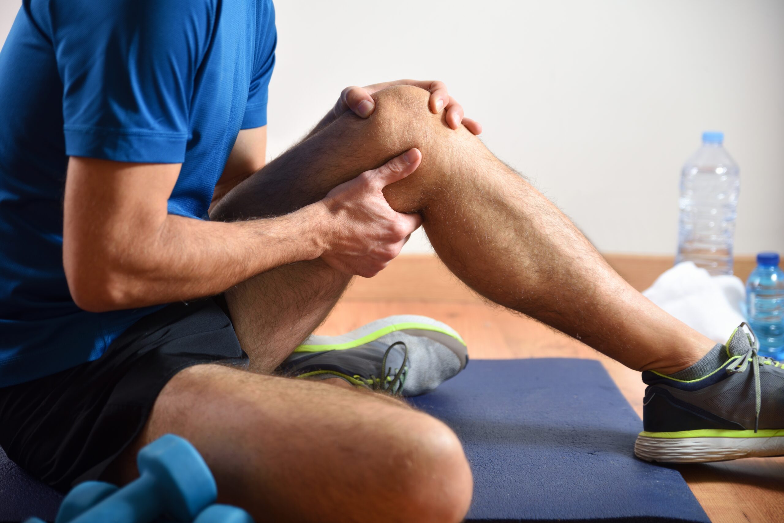 Detail,Of,Man,Doing,Sports,With,Knee,Pain,Holding,Himself