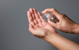 Hand,Of,Lady,That,Applying,Alcohol,Spray,Or,Anti Bacteria,Spray
