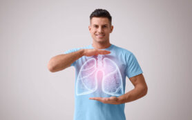 Handsome,Man,Holding,Hands,Near,Chest,With,Illustration,Of,Lungs