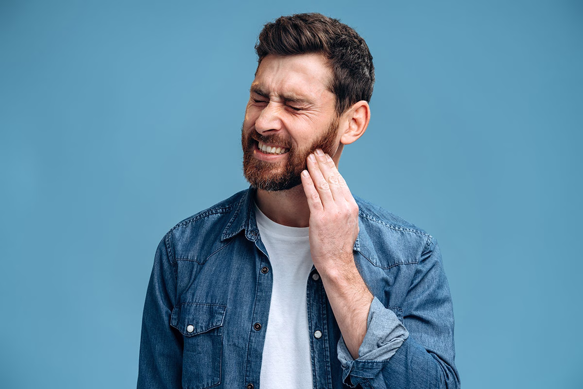 Dental,Problems.,Portrait,Of,Unhealthy,Man,Pressing,Sore,Cheek,,Suffering