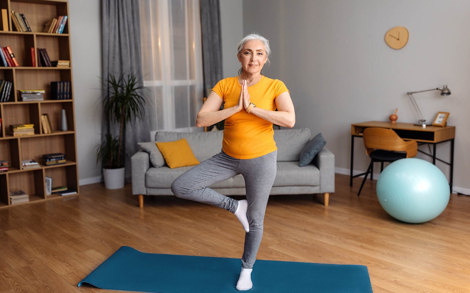 Yoga,Practice,On,Retirement.,Calm,Senior,Lady,Standing,In,Tree