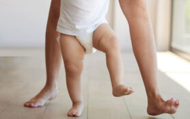 Baby,,Learning,And,Walking,With,A,Child,Taking,Its,First