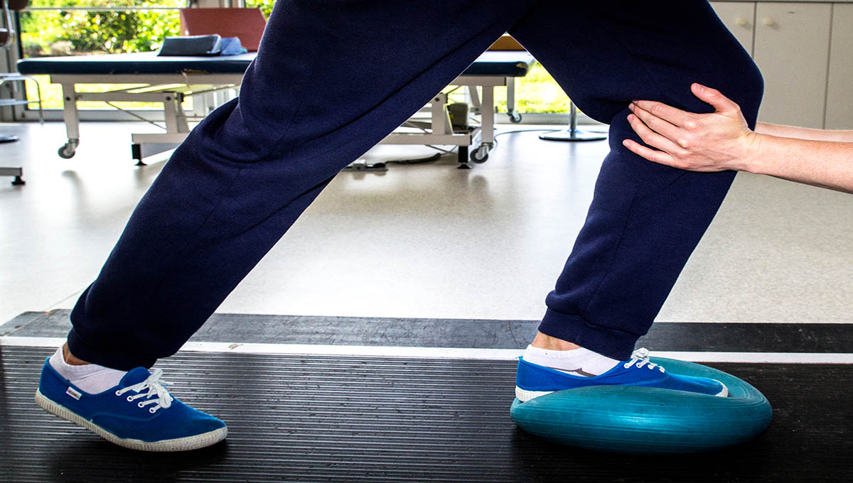 Physical,Therapist,Is,Using,The,Handle,Or,Resistance,With,His