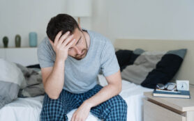 Restless,Man,Waking,Up,Early,With,Headache,After,Rough,Night