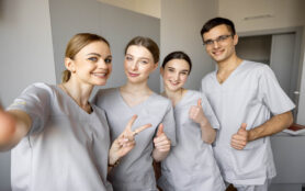 Young,Team,Of,Nurses,Making,Selfie,Photo,,While,Standing,Together