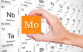 Molybdenum,Symbol,Handheld,In,Front,Of,The,Periodic,Table