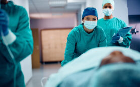 Surgical,Nurse,Taking,The,Patient,Out,Of,The,Operating,Room