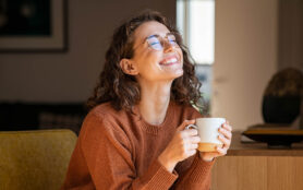 Portrait,Of,Joyful,Young,Woman,Enjoying,A,Cup,Of,Coffee