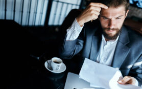 Business,Man,With,A,Beard,,Cafe