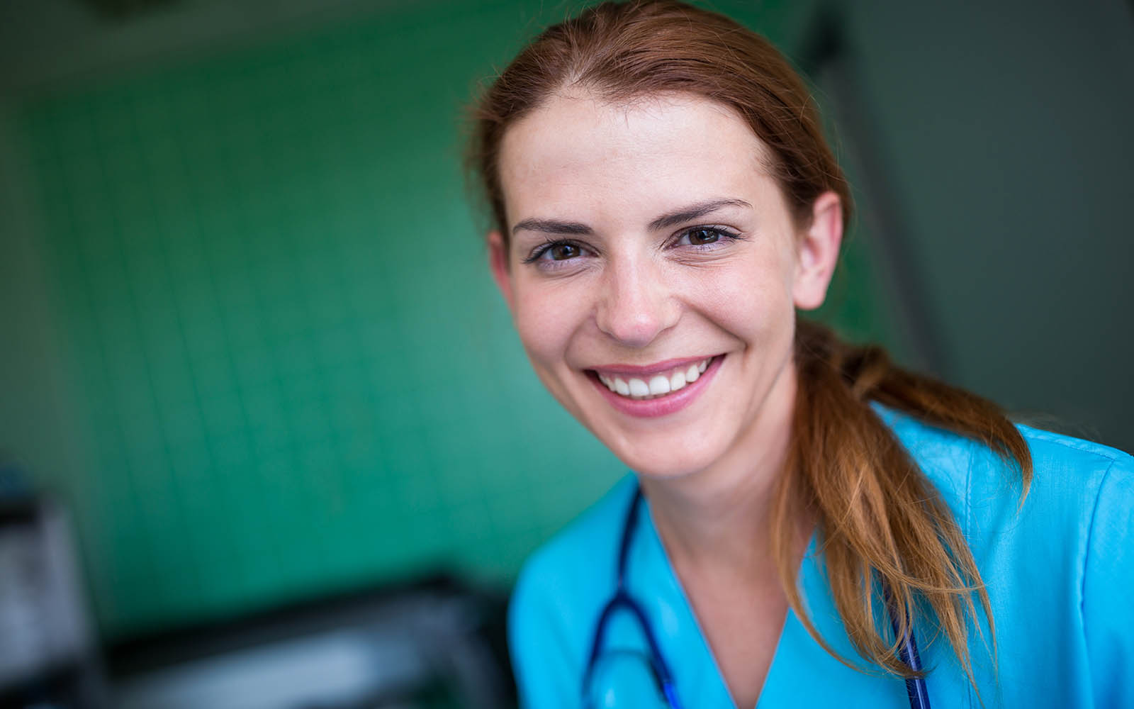 Portrait,Of,Nurse,Smiling,At,Camera,In,The,Hospital